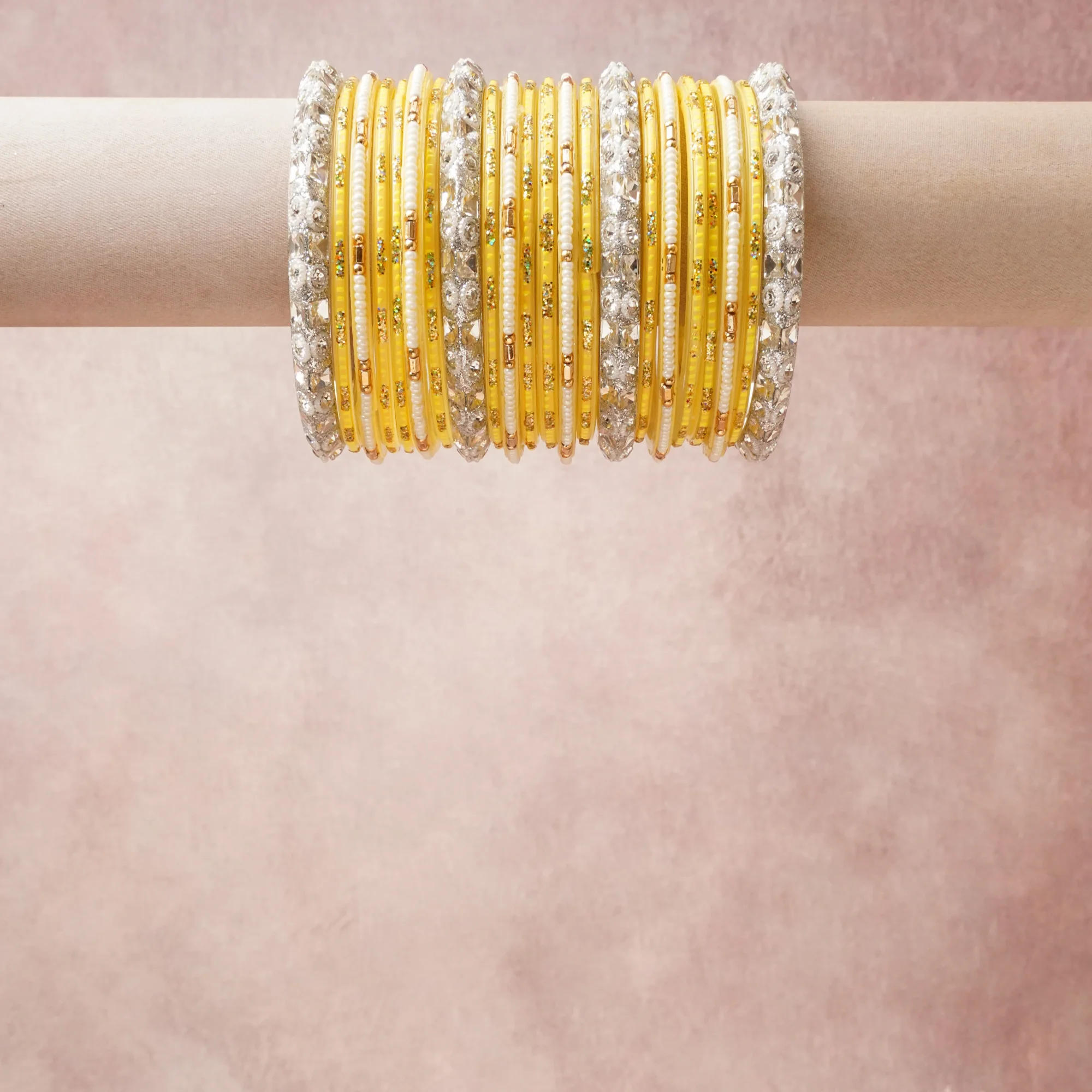 A grounding Lemon Yellow forms the heart of the set, while touches of Silver, Cream White, Antique Gold, Emerald Green add charm.

A thoughtful composition of Glass, Silver-toned Metal, Glass Beads, Mirror Embellishments, Glitter, designed to feel complete without being heavy.
Each element layers seamlessly, creating a look that is refined, wearable and quietly striking.